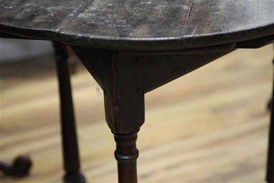 An 18th century circular fruitwood and oak cricket table, W.2ft 2in.